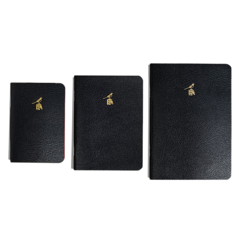 Bieffe Black Notebooks
Three black notebooks of different sizes with gold accents on a white background