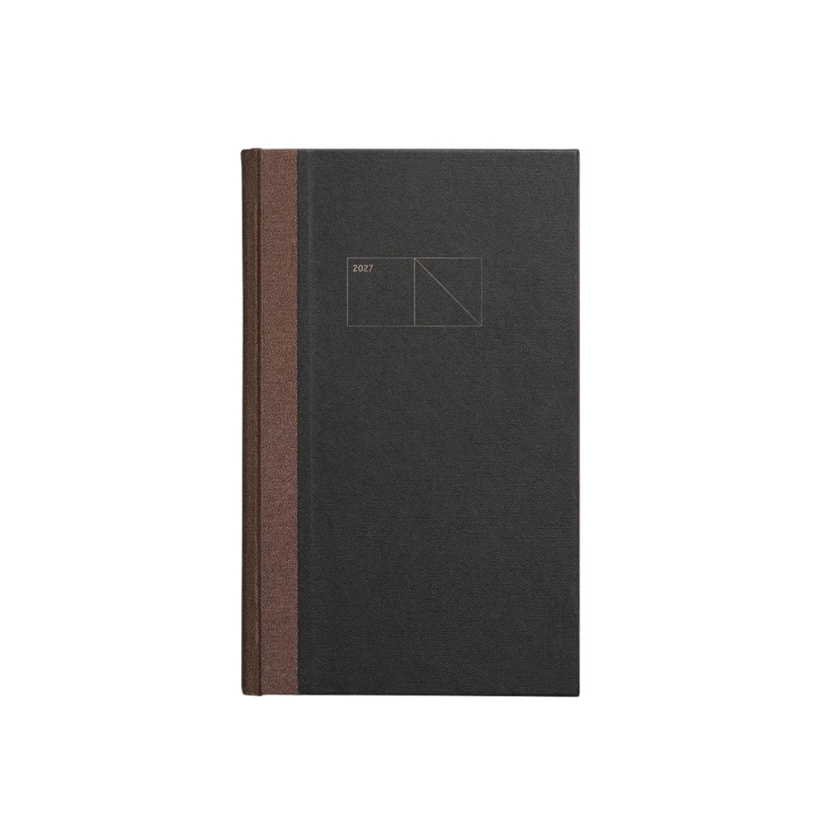 A minimalist hardcover notebook or journal standing upright on a light gray background. The cover is a very dark charcoal gray with a thin vertical brown spine band and a small geometric line drawing printed near the top center. Papierniczeni Copper 2027 Calendar – Graphite