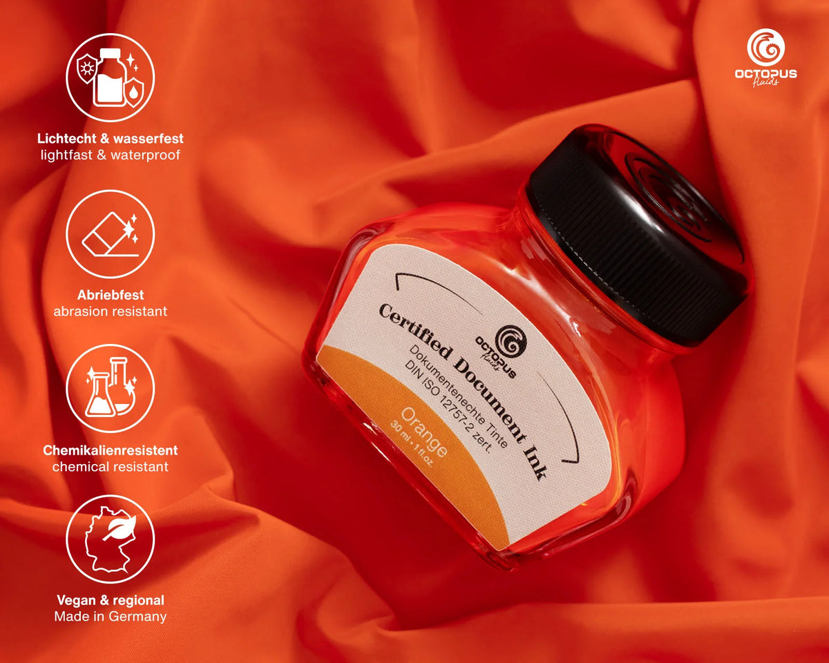 Orange ink bottle with certification details on a red fabric background Octopus Fluids Fountain Pen Document Ink - 30 ml Bottle - Orange -  Made in Germany