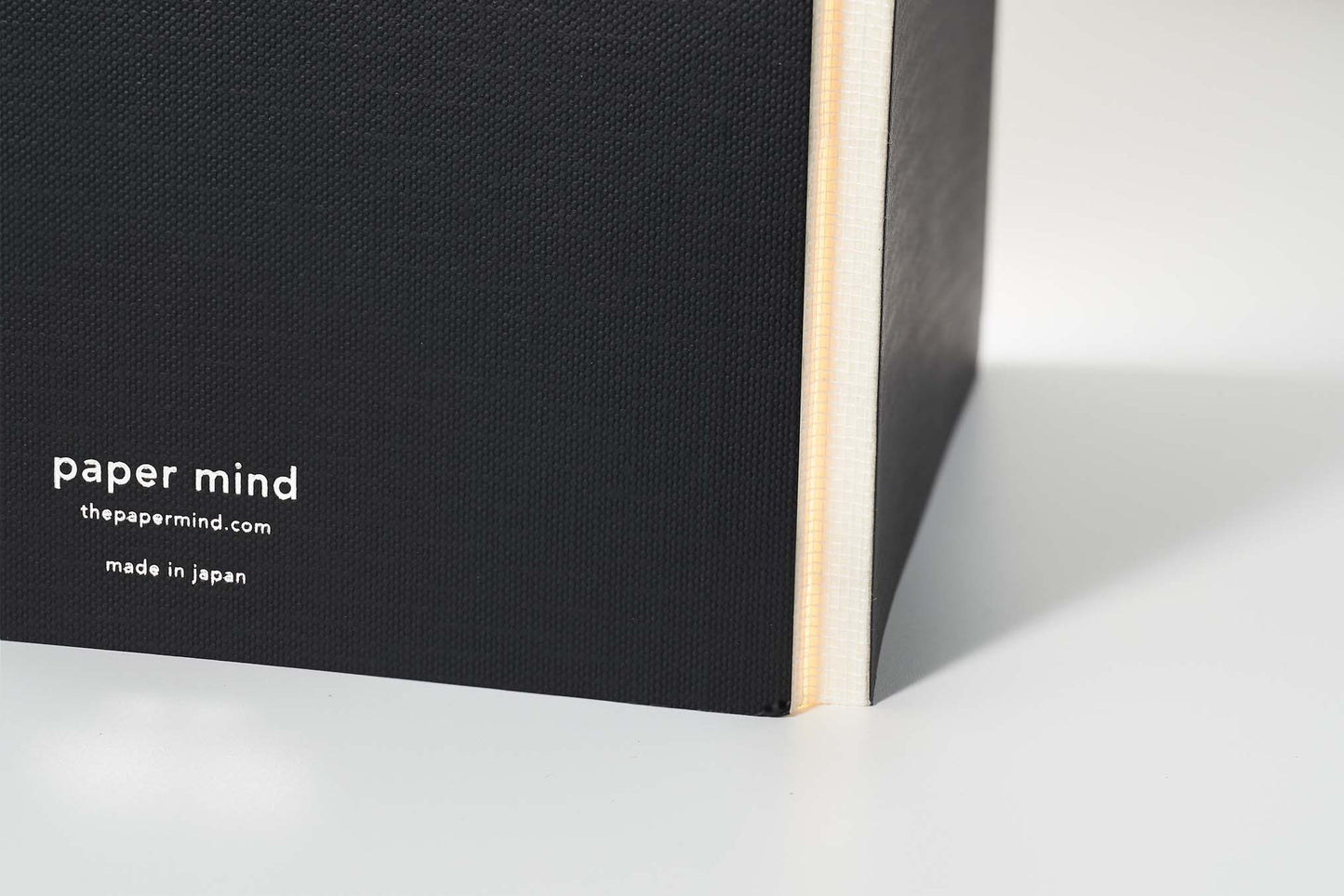 the paper mind Mitsubishi Bank paper notebook standing up showing off the coverless spine